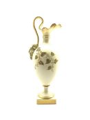 Royal Worcester blush ivory ewer the base of the handle decorated with a satyr mask and decorated wi