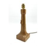 Thompson of Kilburn 'Mouseman' adzed oak table lamp with octagonal stem on a leaf carved square base