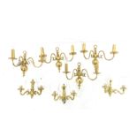 Set of three modern brass two branch wall lights with glass shades, height of backplate 20cm, and a