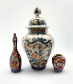 Japanese Imari pattern vase and cover of panel sided design decorated in orange blue and gilt H43cm