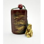 Japanese Meiji nashiji lacquer five case inro decorated in low relief with a mountainous landscape,