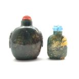 Chinese moss agate style snuff bottle with ring handles and cinnabar stopper, H8cm together with a s