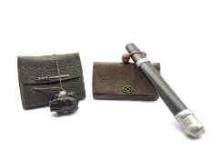 Two Japanese leather tobacco pouches (tabako-ire), one with incised black lacquer pipe case (Kiseruz