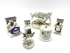 Late 19th/early 20th century Staffordshire pottery cow and calf on naturalistic base W17cm