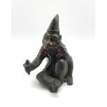 Japanese Meiji patinated bronze figure of a macaque monkey modelled as a Sarumawashi, seated cross