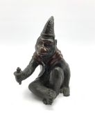 Japanese Meiji patinated bronze figure of a macaque monkey modelled as a Sarumawashi, seated cross