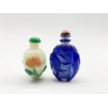 Chinese Peking glass snuff bottle decorated in blue glass overlay with an Elephant and coral coloure