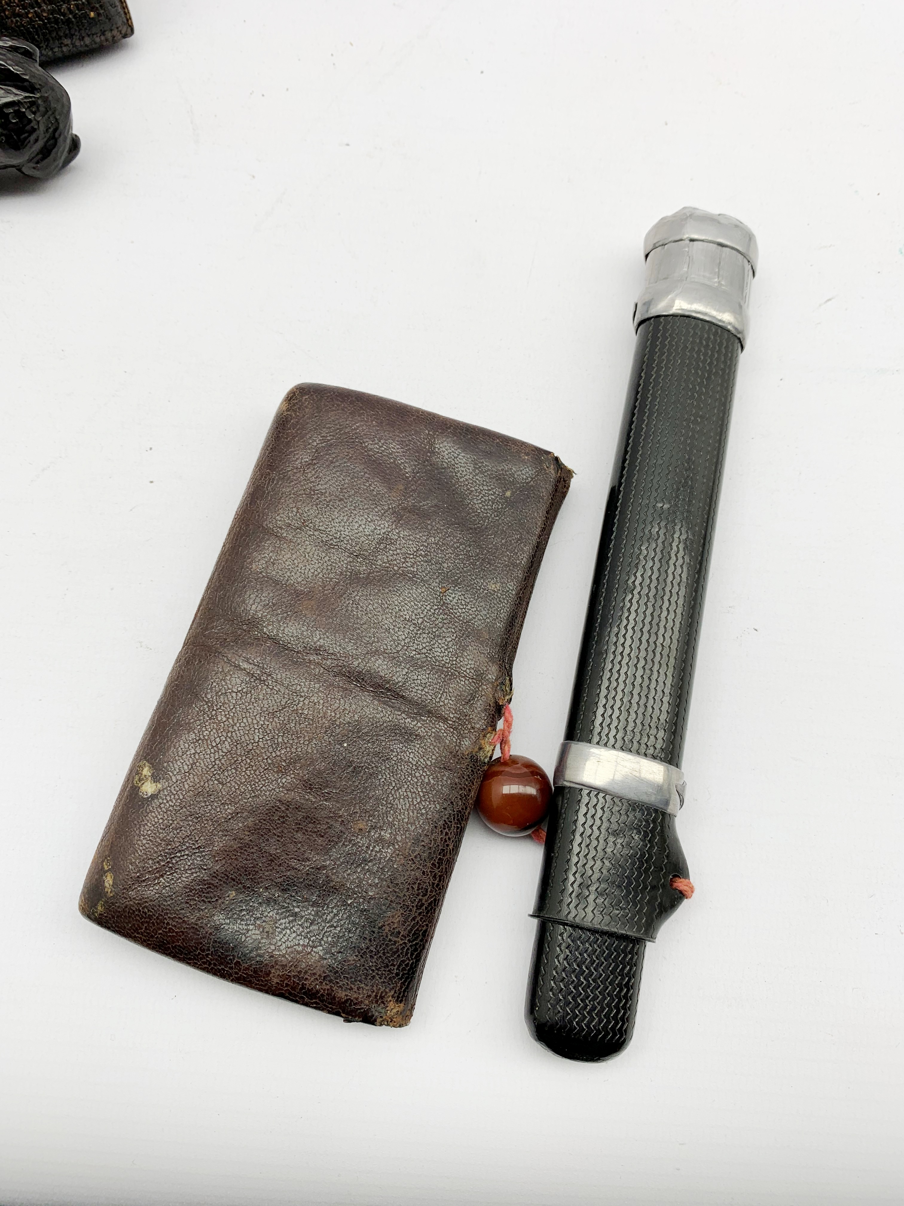 Two Japanese leather tobacco pouches (tabako-ire), one with incised black lacquer pipe case (Kiseruz - Image 4 of 5