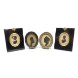 Pair of 19th century oval silhouette portraits 9cm x 6.5cm in ebonised frames and two other silhouet