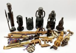 Number of African carved wood tribal figures, African sword in leather scabbard and other African i