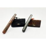 Japanese Meiji tobacco pouch (tabako-ire) with metal mae-kanagu, stained wooden ojime bead and black