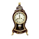 Rococo style eight day mantle clock of cartouche form, with gilt decoration and hand painted floral