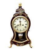 Rococo style eight day mantle clock of cartouche form, with gilt decoration and hand painted floral