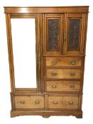 Late Victorian wardrobe, double urn carved cupboard enclosing two fixed shelves above three graduati