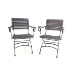 Pair of stained slatted hardwood and wrought metal folding garden chairs
