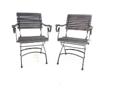 Pair of stained slatted hardwood and wrought metal folding garden chairs