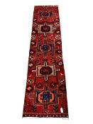 Persian Heriz red and blue ground runner, cross door design 300cm x 78cm