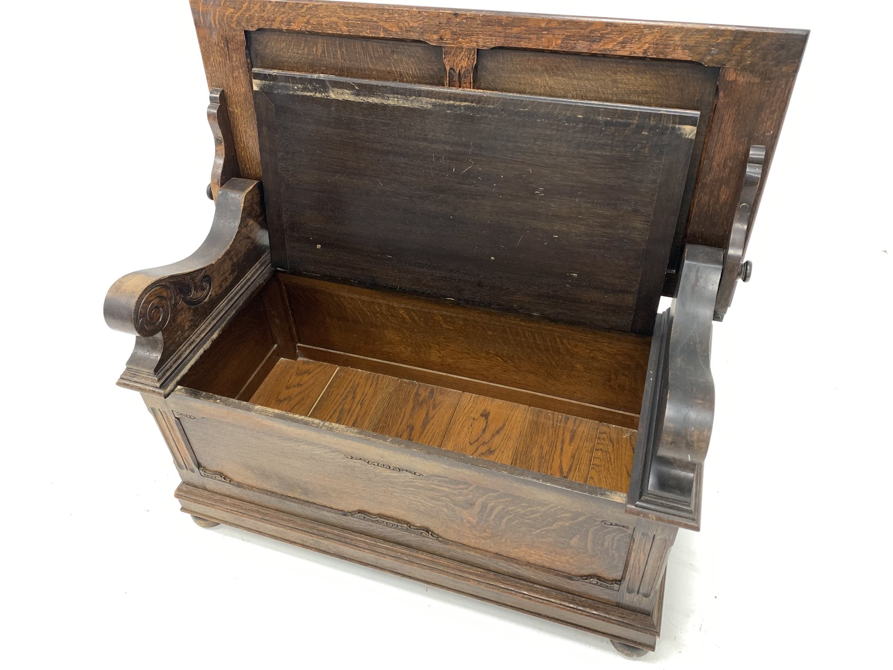 Early 20th century oak monks bench, the folding panelled back rest over hinged seat, panelled front - Image 4 of 4