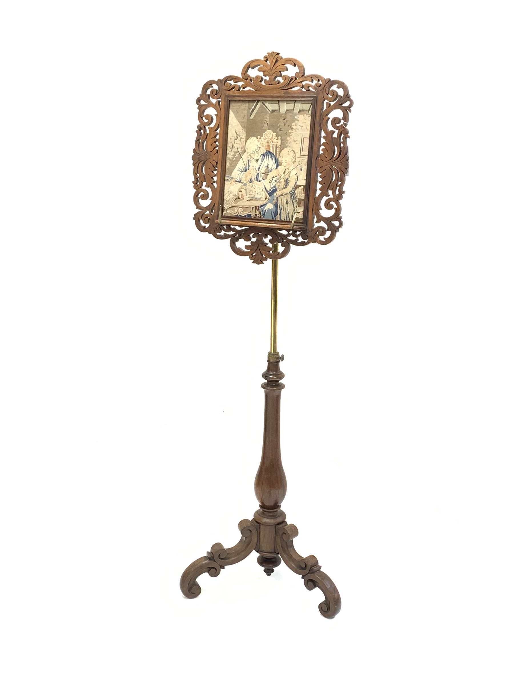 Victorian rosewood and brass music stand, floral fretwork frame enclosing needlework panel depicting