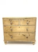 Victorian pine chest fitted with two short and two long drawers, turned supports