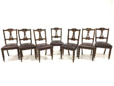 Set seven late Victorian mahogany dining chairs, leaf and scroll carved cresting rail centred by flo