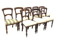 Matched set of eight Victorian mahogany dining chairs, with shaped cresting rail over floral carved