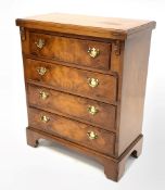 George III style burr walnut bachelors chest, moulded hinged fold over top over three long drawers,