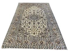 Persian fine Kashan ivory ground carpet, centred by floral medallion, triple guarded border