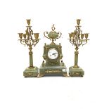 Late 19th century onyx and gilt three-piece clock garniture, the clock case surmounted by an urn sha
