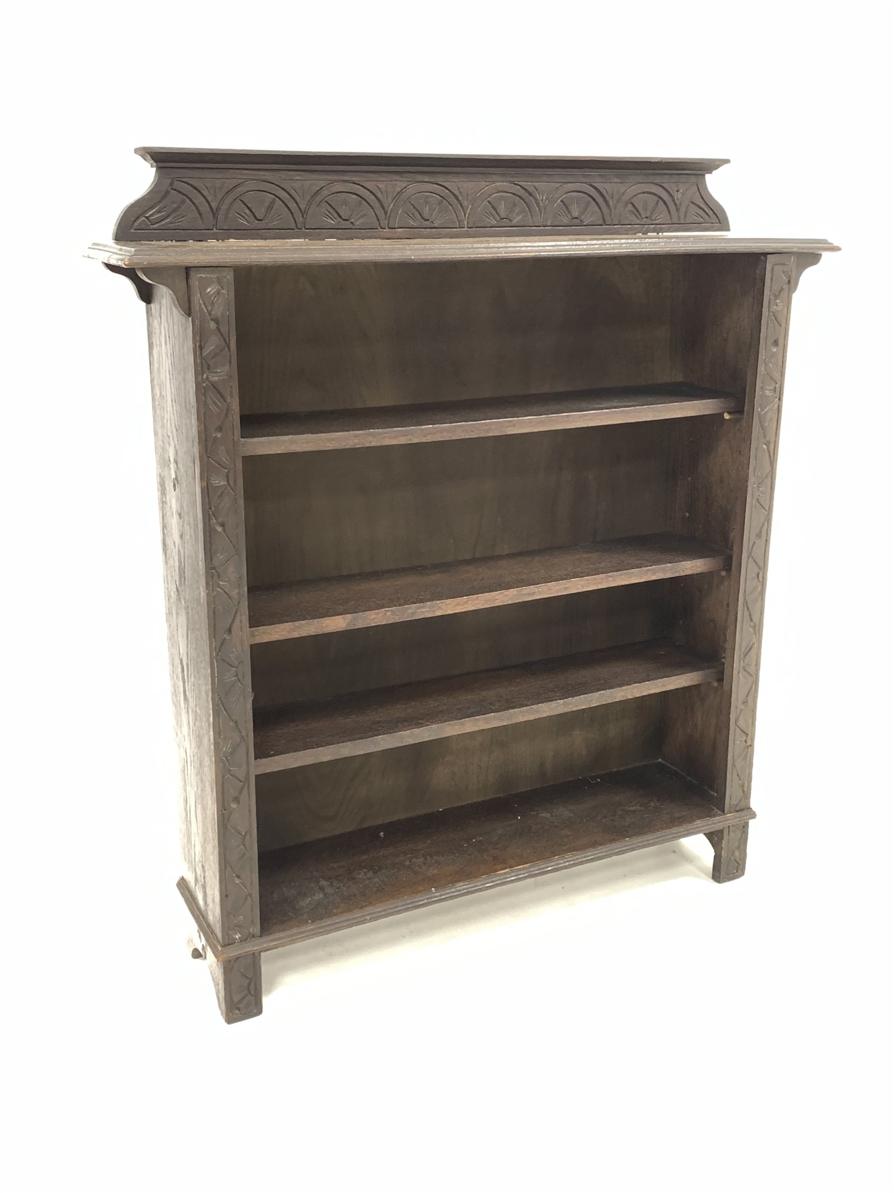 Early 20th century dark oak open bookcase, the raised back with lunette carving over three adjustabl - Image 3 of 6