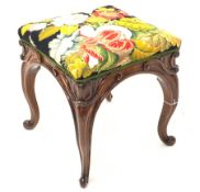 Early Victorian solid rosewood stool, floral needlework upholstered seat, raised on scroll carved ca