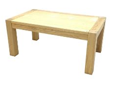 Contemporary solid light oak coffee table, rectangular supports raised on square supports