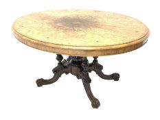 Victorian inlaid walnut oval loo table, the quarter sawn veneered and moulded top raised on four col