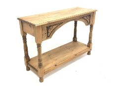 Victorian style pine side table, rectangular moulded top over arched apron carved with acorns and oa