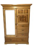 Late Victorian satin walnut wardrobe, the left hand side enclosed by bevelled mirror door, two carv