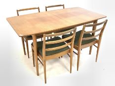 McIntosh & Co Ltd - Mid century teak extending dining table, top splitting to reveal concealed leaf,