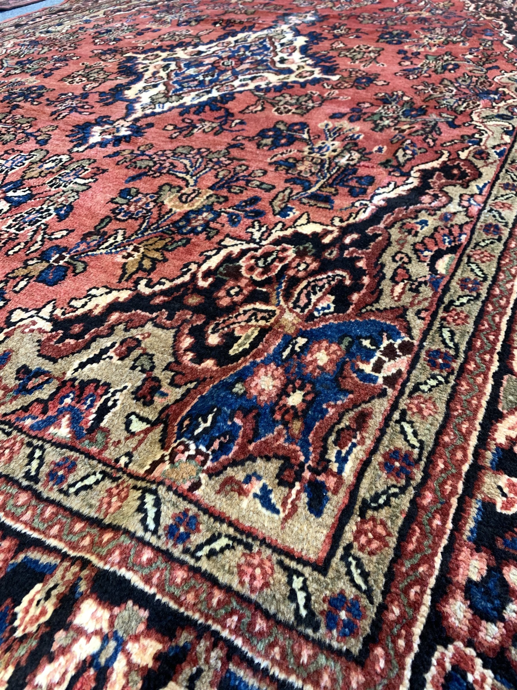 Persian Sarouk full pile red ground Persian Sarouk carpet, with floral medallion 305cm x 200cm - Image 2 of 3