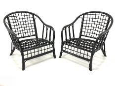 Pair of mid century black painted bamboo conservatory chairs, with lattice back and seat panel and o