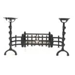 Wrought iron fire basket with integral andirons,