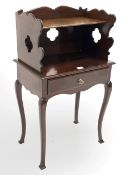 Edwardian mahogany bedside table, the raised, shaped and pierced back with open shelf over one drawe