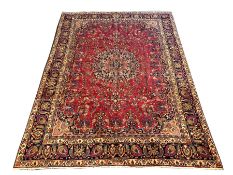 Large Persian Mashad red ground with all over floral field centred by lozenge medallion 377 x 277