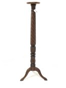 20th century mahogany torchere, circular dished top over leaf carved and spiral turned column, raise