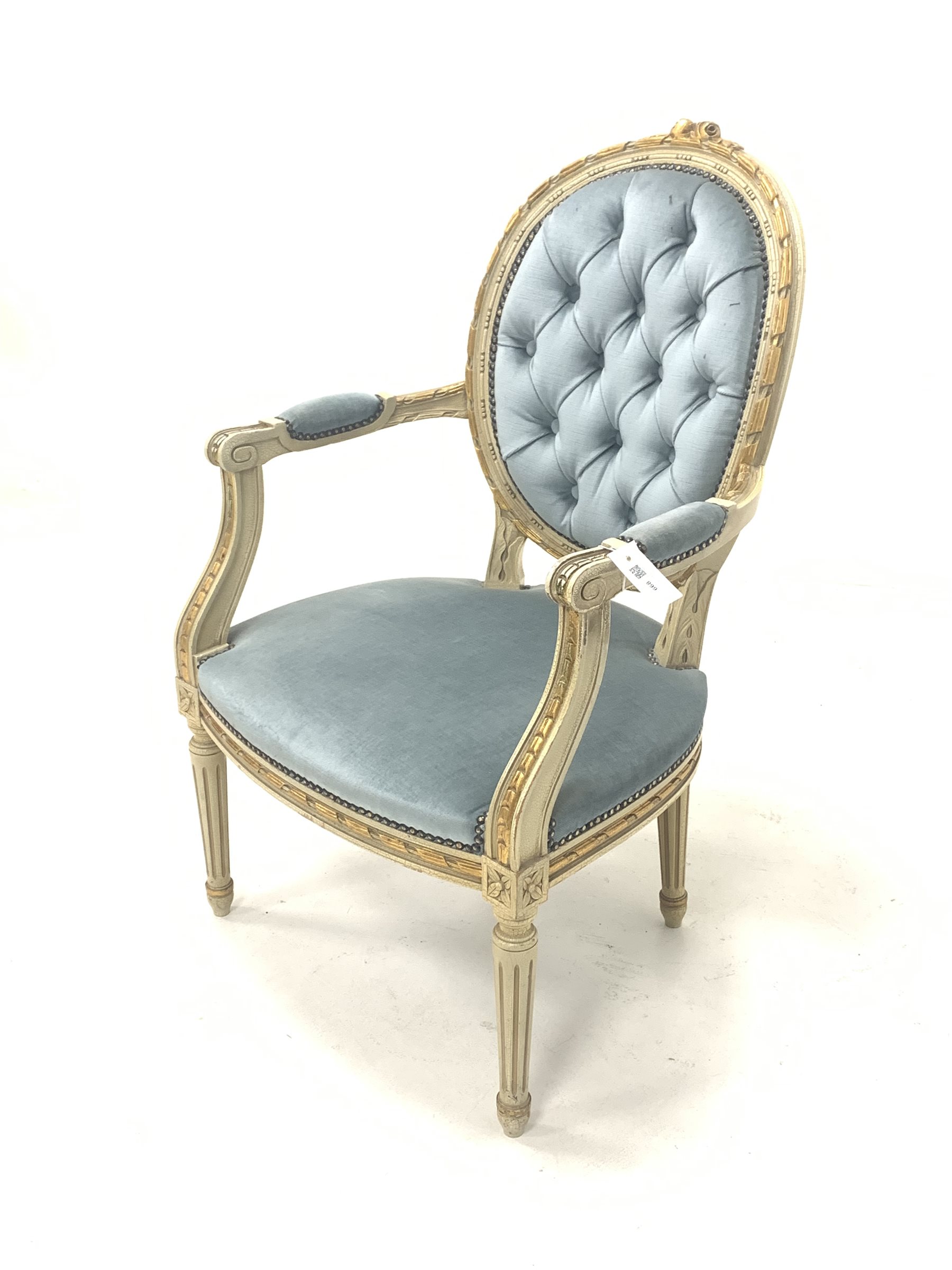 Louis XV style cream and gilt painted open armchair, the buttoned back rest over scrolled arm termin