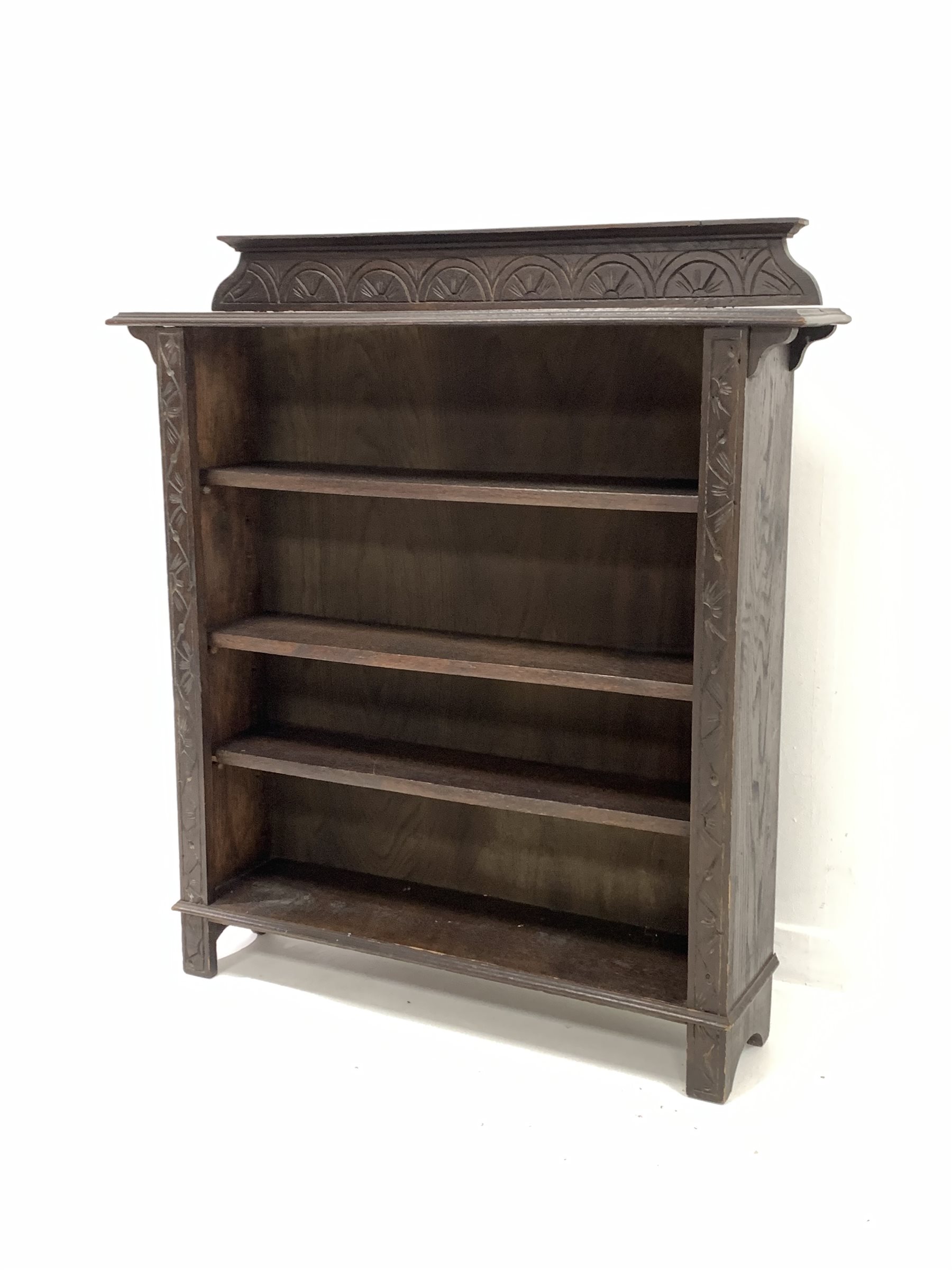 Early 20th century dark oak open bookcase, the raised back with lunette carving over three adjustabl - Image 2 of 6