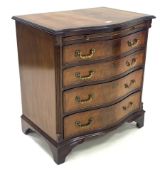 Georgian design mahogany serpentine front chest, cross banded moulded top over brushing slide and fo