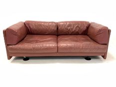 Mid 20th century two seat sofa, upholstered in red leather, with zipped on loose cushions, circa 197