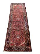 Large washed red ground Persian Hamadan village runner, all over design 330cm x 115