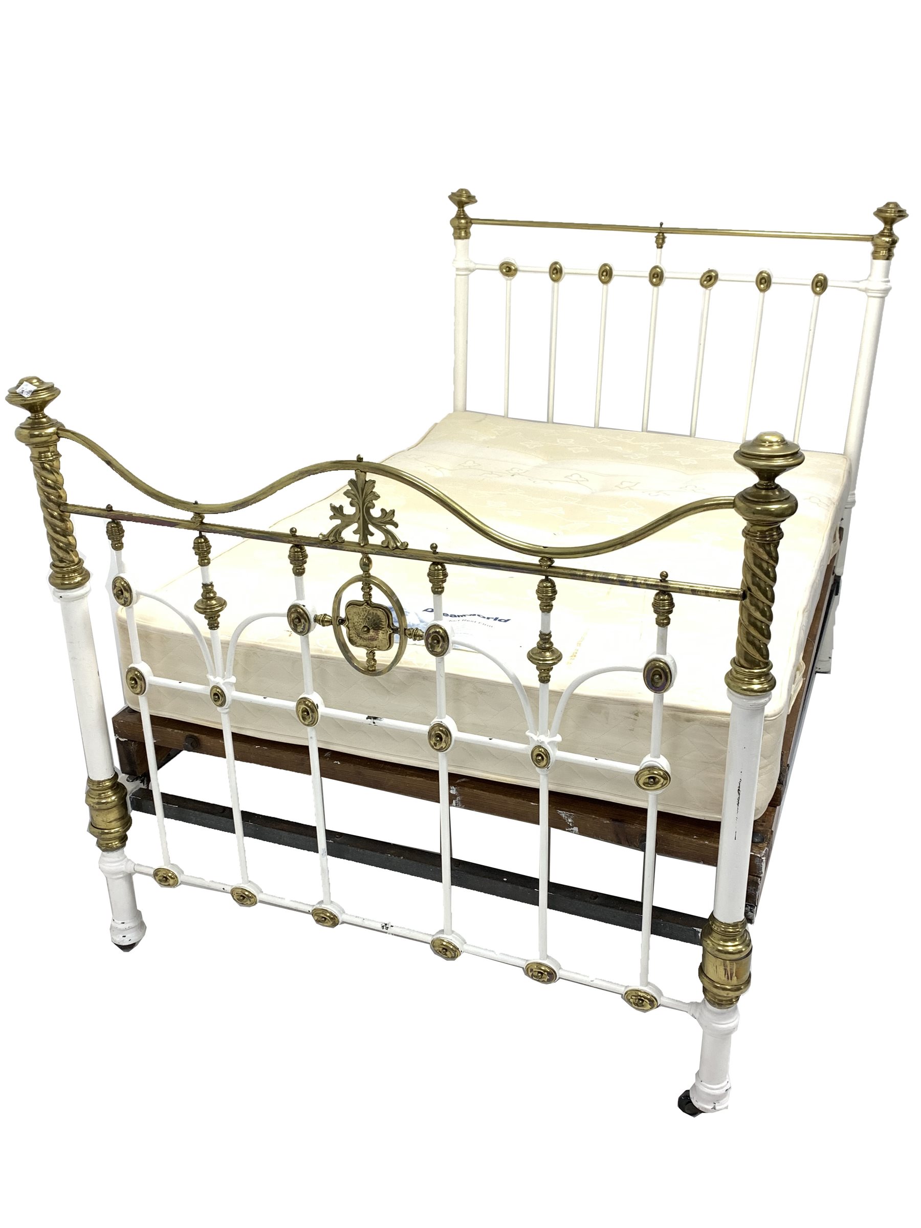 Victorian white painted iron and brass double bedstead, with cast spiral and leaf decoration, raised