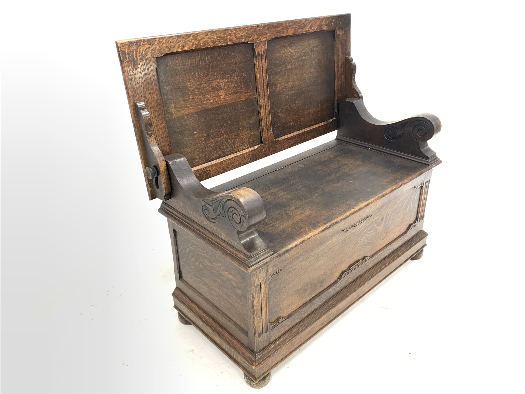 Early 20th century oak monks bench, the folding panelled back rest over hinged seat, panelled front - Image 2 of 4