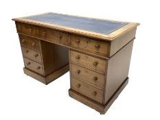 Victorian mahogany twin pedestal desk, the rectangular top inset with blue tooled leather writing su